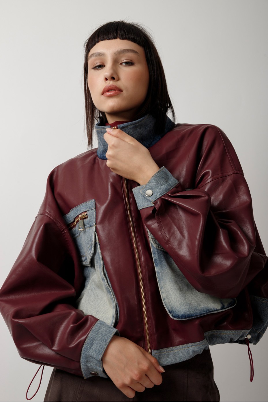 LEATHER JACKET WITH JEANS DETAILS